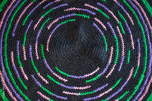 Background of multi-colored circular knit carpet. Copy space