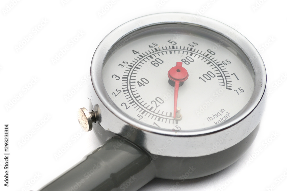 Pressure gauge for measuring air pressure in car tires on a white background Pressure gauge for measuring air pressure in car tires on a white background