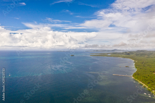 Beautiful seascape. Sea with lagoons and islands, blue sky with big clouds. Philippine nature.