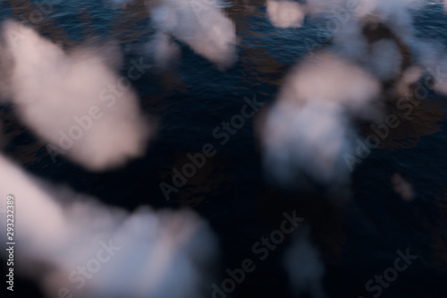 The wide ocean with sunshine going through the clouds, 3d rendering.