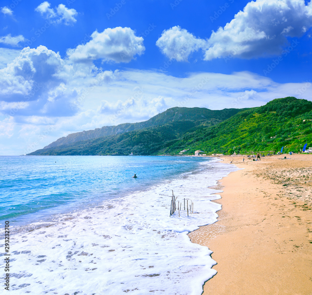 Beautiful summertime panoramic seascape. Awesome view picturesque green slopes coastline sea and golden sand beach shore in the crystal clear azure water sea bay.
