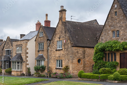BROADWAY, ENGLAND - MAY, 27 2018: Pretty Cottages with climbing plants in the village of Broadway, in the English county of Worcestershire, Cotswolds, UK 