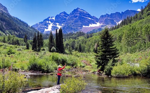 Fly fishing in Colorado with the Maroon Bells in the background