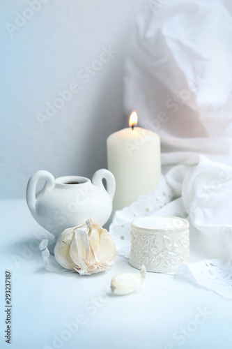 garlic, concept of health, winter colds and treatments, winter decorations, candle, close-up, copy space