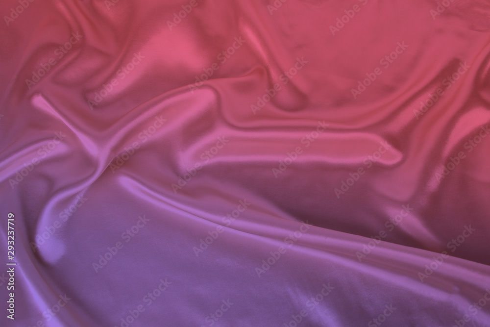 Fototapeta premium soft folds on delicate pink shiny silk, luxury concept, background for the designer, horizontal, close-up, copy space