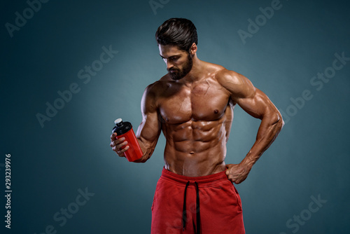 Muscular Men Drinks Protein Drink, Energy Drink © mrbigphoto