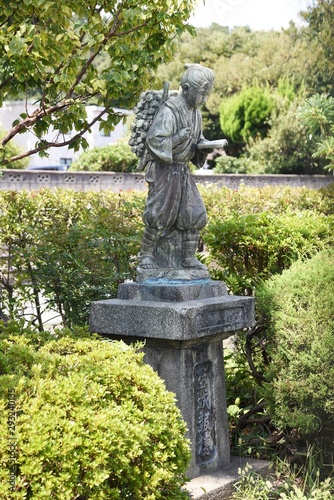 Japanese great man Kinjiro Ninomiya (Sontoku Ninomiya) statue / Japanese statesman, agriculturist, philosopher. photo