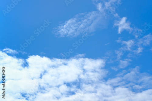 Real blue sky with light clouds. Natural sky background.