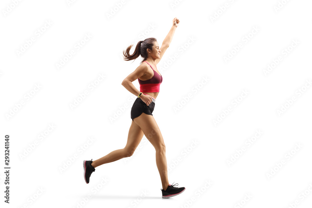 Fit young woman in sportswear running and gesturing with hand