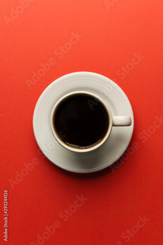 Turkish coffee, white cup and white plate on vivid background