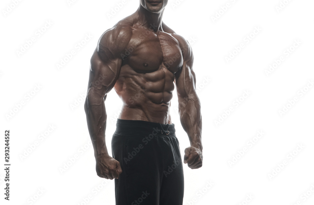 Fitness model man posing in studio Fitness model man posing in studio