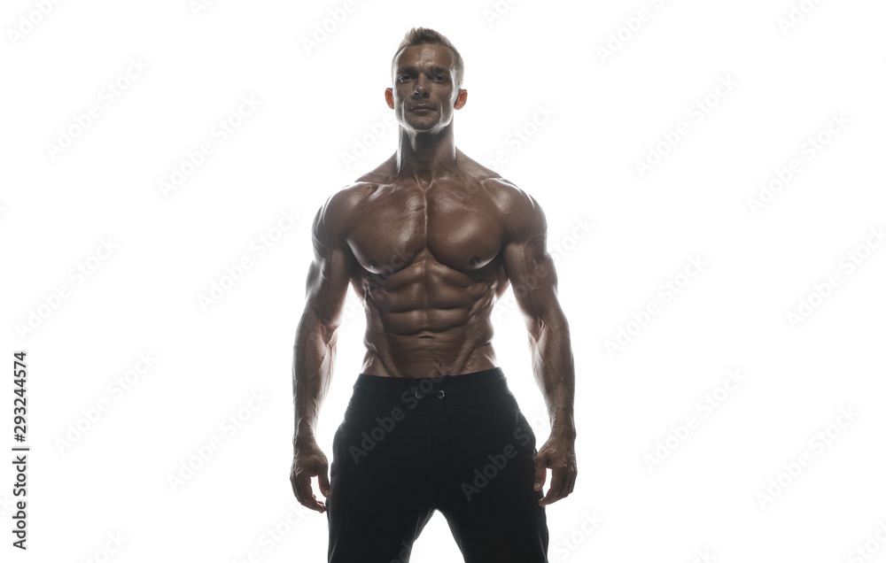 Fitness model man posing in studio