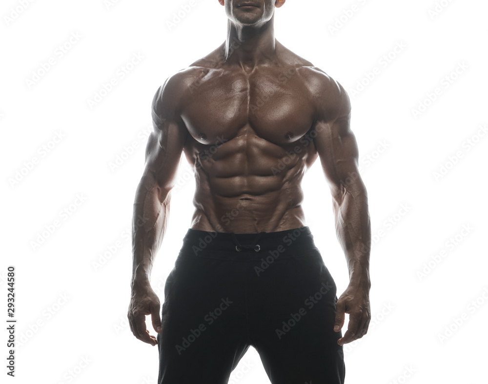 Fitness model man posing in studio Fitness model man posing in studio