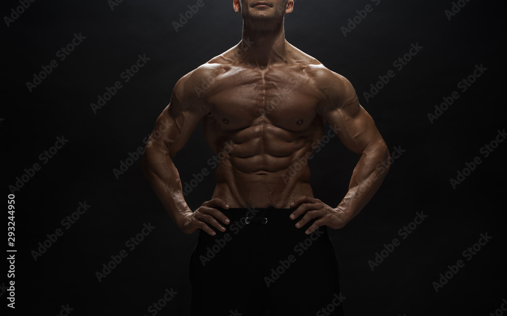 Fitness model man posing in studio Fitness model man posing in studio