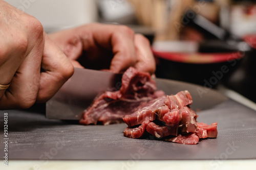 Chef preparing steak tartar of old cow sirloin with 40 days of maturation on restaurant