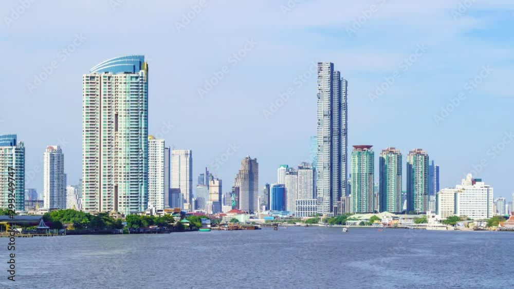 Time lapse: Bangkok waterfront cityscape and Chao Phraya River during sunny day. Zoom in. Time lapse: Bangkok waterfront cityscape and Chao Phraya River during sunny day. Zoom in.