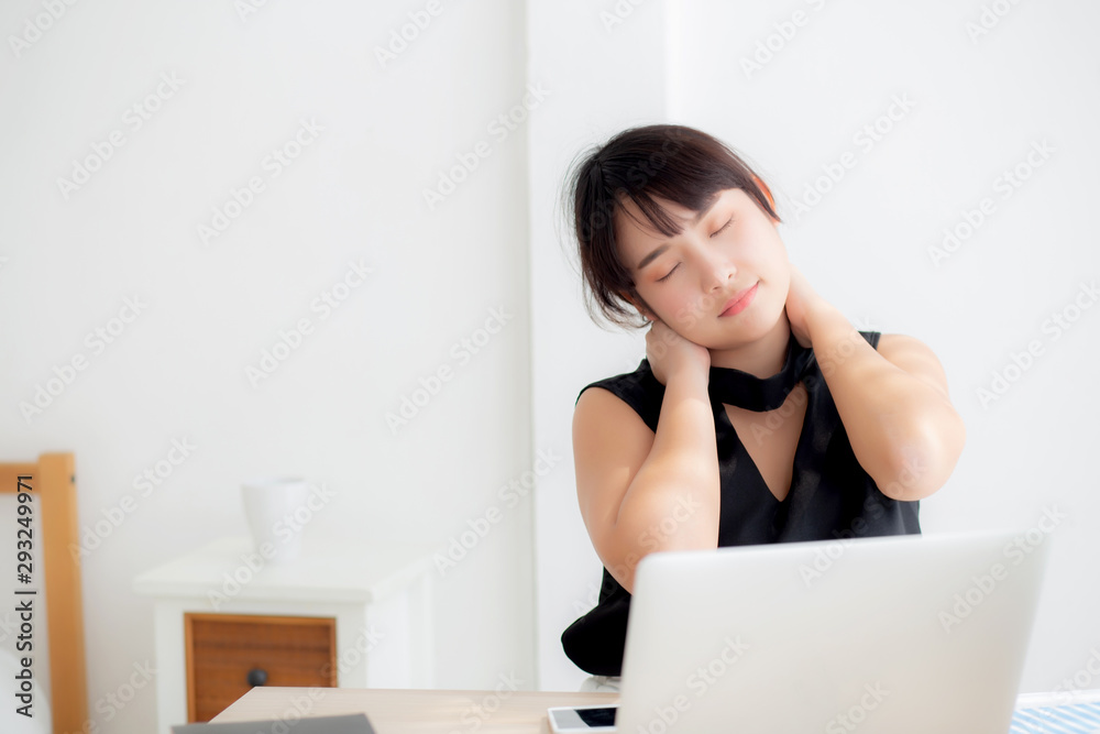 Business woman overwork on laptop computer and neck pain with at work in office, girl stress and illness chronic with office syndrome, health and emotion concept. Business woman overwork on laptop computer and neck pain with at work in office, girl stress and illness chronic with office syndrome, health and emotion concept.