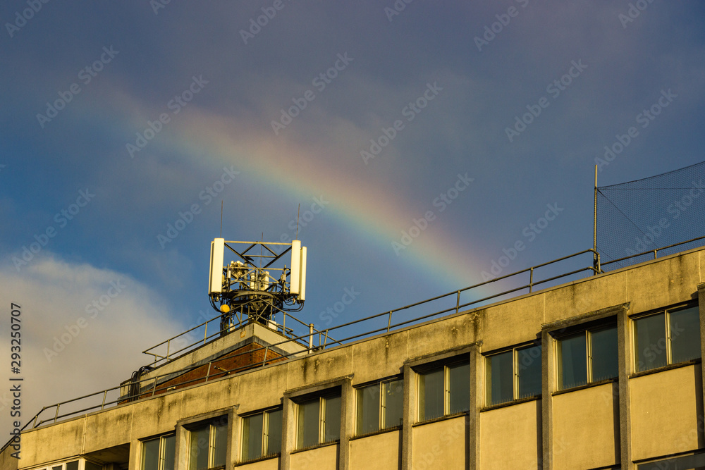 Fototapeta premium A rainbow over a phone mast