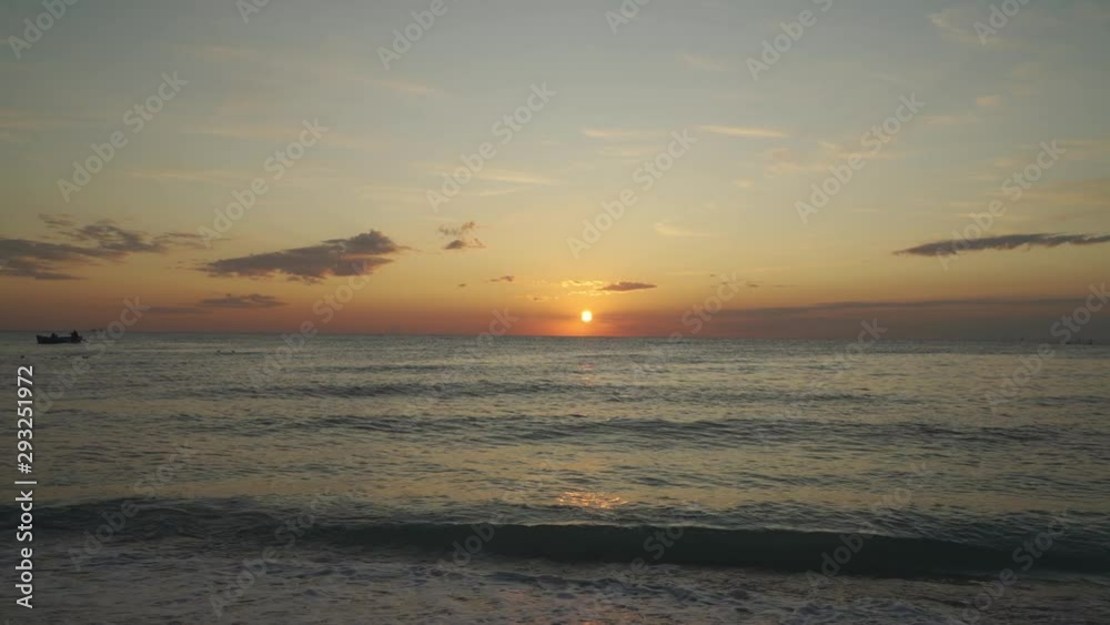 Sunset view from beach, waves crashing during sunset Sunset view from beach, waves crashing during sunset