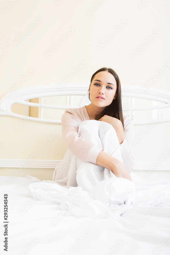 young pretty brunette woman laying in bed alone waiting sexy, lifestyle people concept young pretty brunette woman laying in bed alone waiting sexy, lifestyle people concept