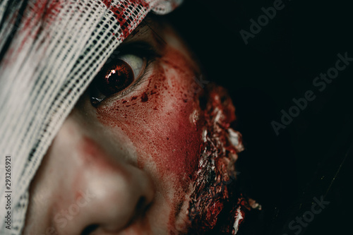 Close-up zombie women looks at her with resentment in an abandoned building  Halloween murder concept.