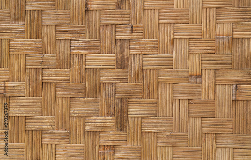 Closeup of vintage handmade  bamboo wall of cottage. A natural background and backdrop. 