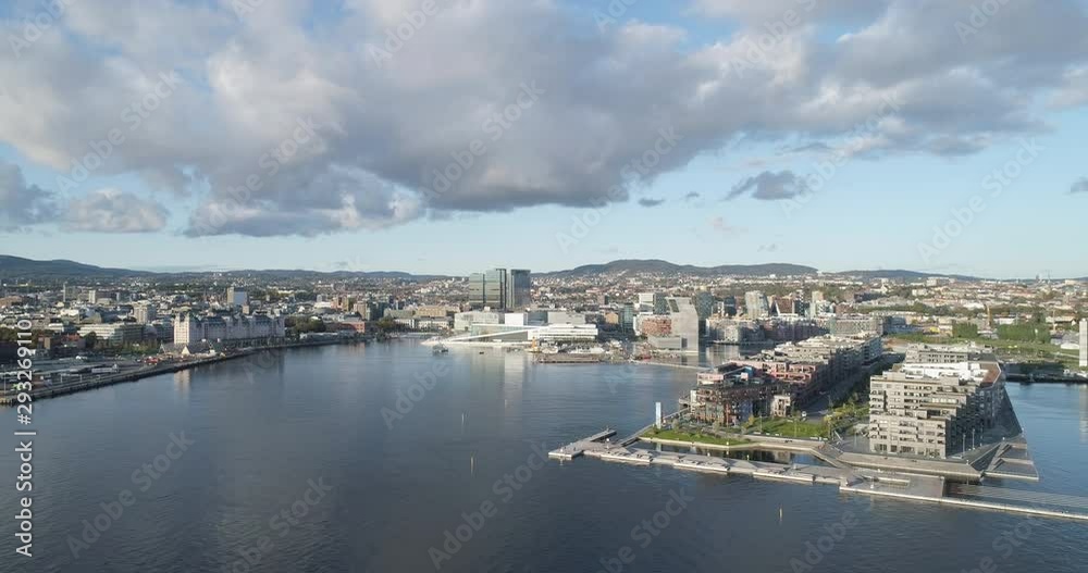 Cinema 4K drone shot with backward motion of the new Bjørvika quarter, with the Lambda Munch Museum, Oslo Opera House and Sørenga in clear daylight in autumn fall, in Oslo Norway. Cinema 4K drone shot with backward motion of the new Bjørvika quarter, with the Lambda Munch Museum, Oslo Opera House and Sørenga in clear daylight in autumn fall, in Oslo Norway.