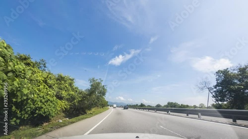 drivelapse of car with clear blue skyl photo