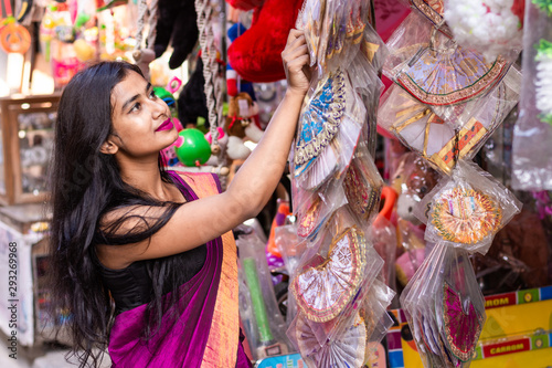 Beautiful woman doing shopping for festival season like Diwali, Durga puja and Christmas 