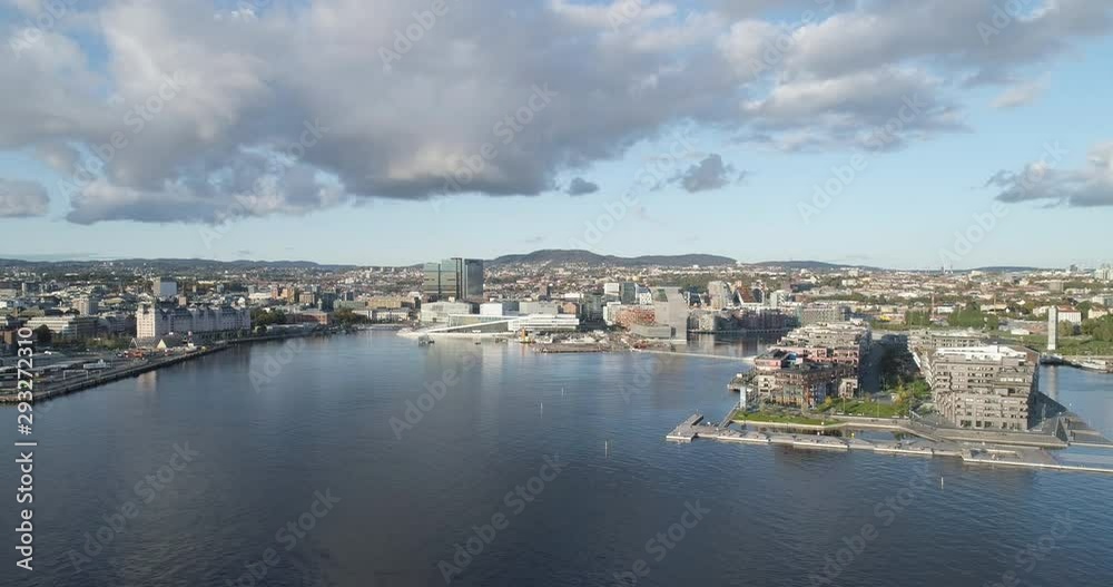 Cinema 4K drone shot with parallax motion of the new Bjørvika quarter, with the Lambda Munch Museum, Oslo Opera House and Sørenga in clear daylight in autumn fall, in Oslo Norway. Cinema 4K drone shot with parallax motion of the new Bjørvika quarter, with the Lambda Munch Museum, Oslo Opera House and Sørenga in clear daylight in autumn fall, in Oslo Norway.