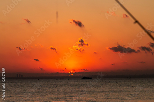 Romantic Natural Sunset Sunrise Over Field Or Meadow. Bright Dramatic Sky And Dark Ground. Countryside Landscape Under Scenic Colorful Sky At Sunset Dawn Sunrise. Sun Over Skyline, Horizon