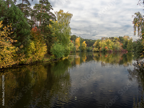 Fototapeta Naklejka Na Ścianę i Meble -  Autumn, river, trees, foliage, clouds.