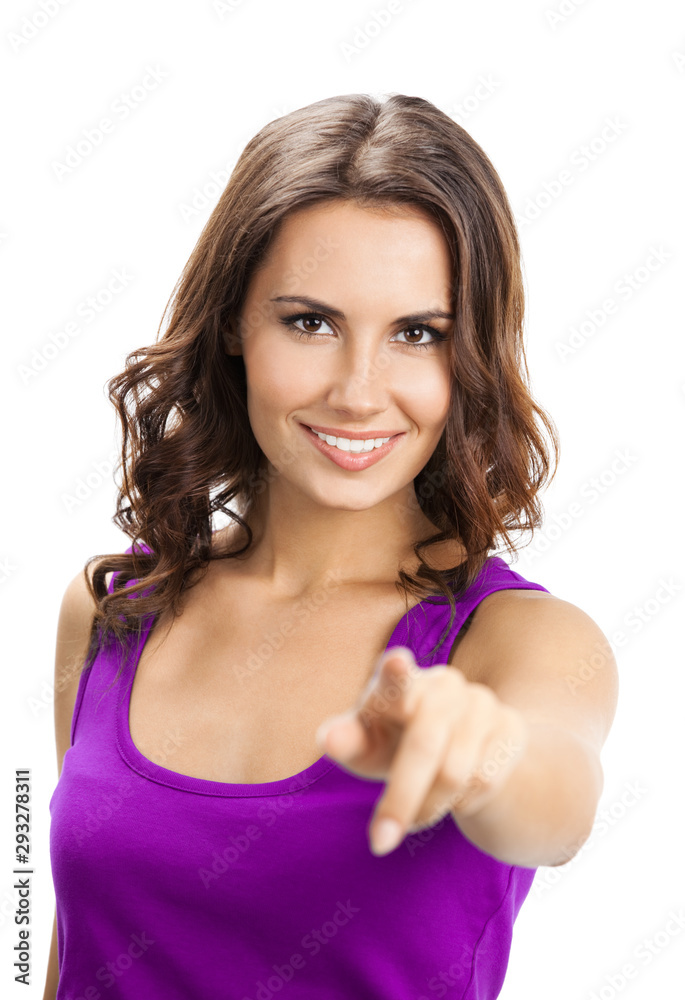 Happy smiling beautiful young brunette woman in casual lilac clothing, showing copy space, visual imaginary or something, or pressing virual button, isolated over white background Happy smiling beautiful young brunette woman in casual lilac clothing, showing copy space, visual imaginary or something, or pressing virual button, isolated over white background
