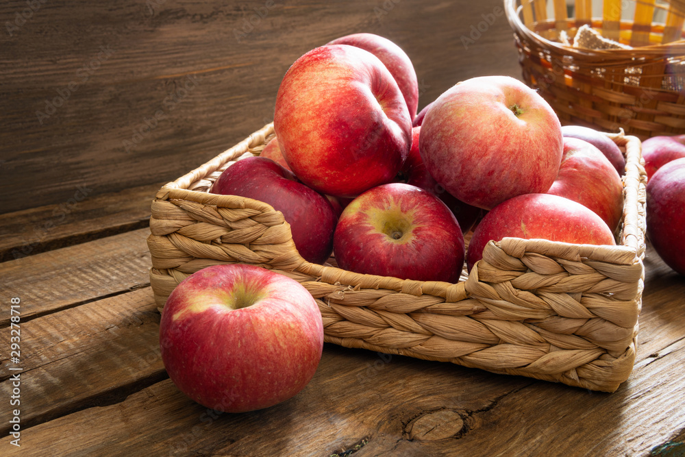 Apples lie on wooden planks, ripe red fruits Apples lie on wooden planks, ripe red fruits