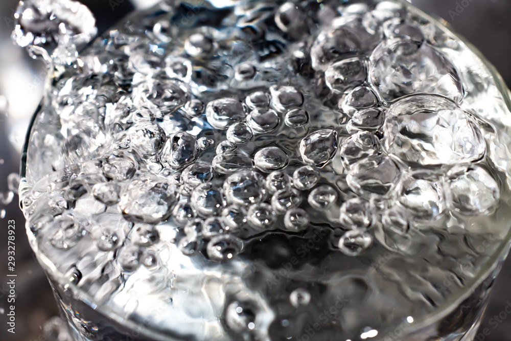Clear water bubbles floating in transparent glass, Close up & Macro shot, Selective focus, Healthy Drink concept Clear water bubbles floating in transparent glass, Close up & Macro shot, Selective focus, Healthy Drink concept