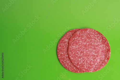 slices of salami in colorful background