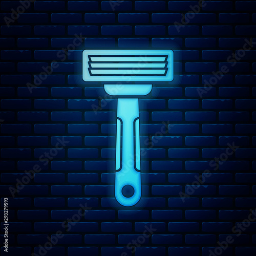 Glowing neon Shaving razor icon isolated on brick wall background. Vector Illustration