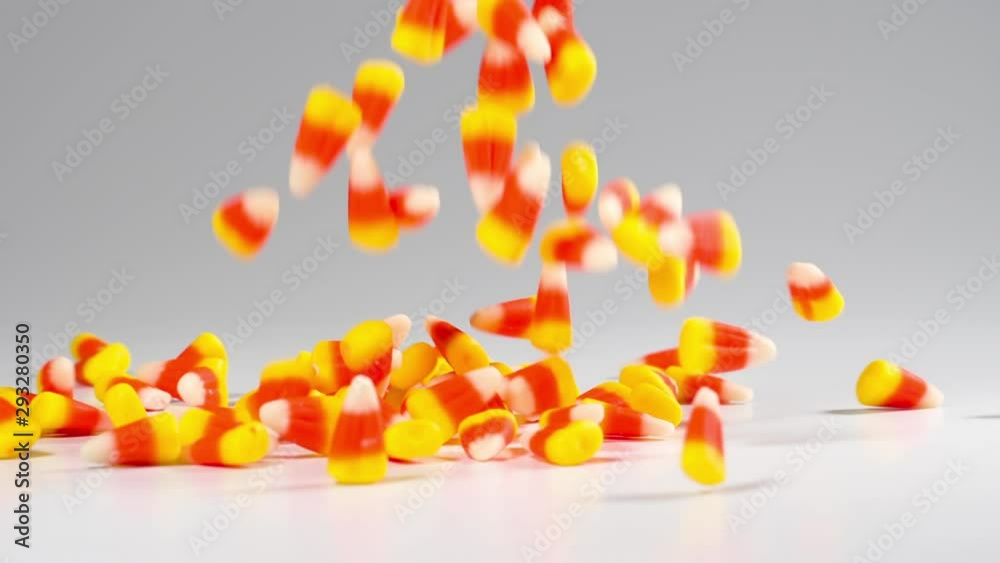 Time for Halloween. Delicious candy corn falls in slow motion.