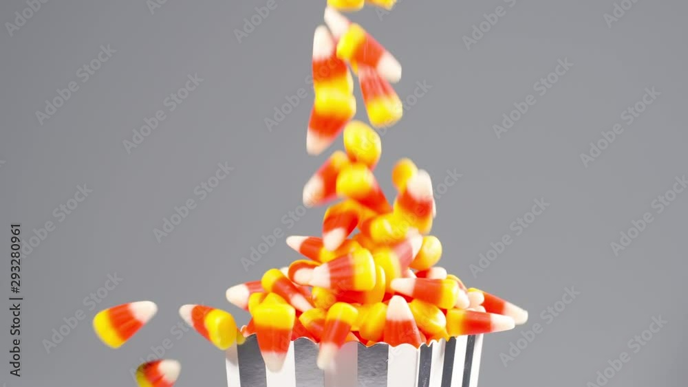 Time for Halloween. Delicious candy corn falls in slow motion.