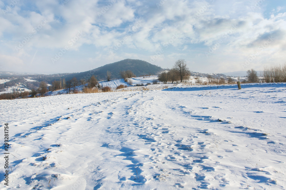 Fields and hills under the snow in winter.