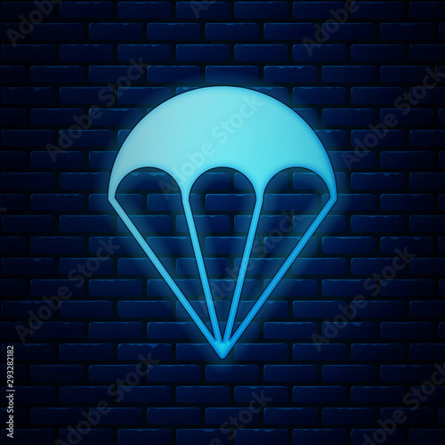 Glowing neon Parachute icon isolated on brick wall background. Extreme sport. Sport equipment. Vector Illustration