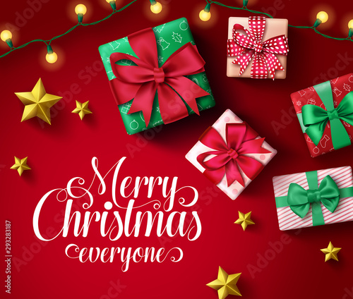 Merry christmas greeting card vector banner template. Merry christmas everyone typography in empty space with colorful elements of xmas gifts  lights and golden stars in night red background. 