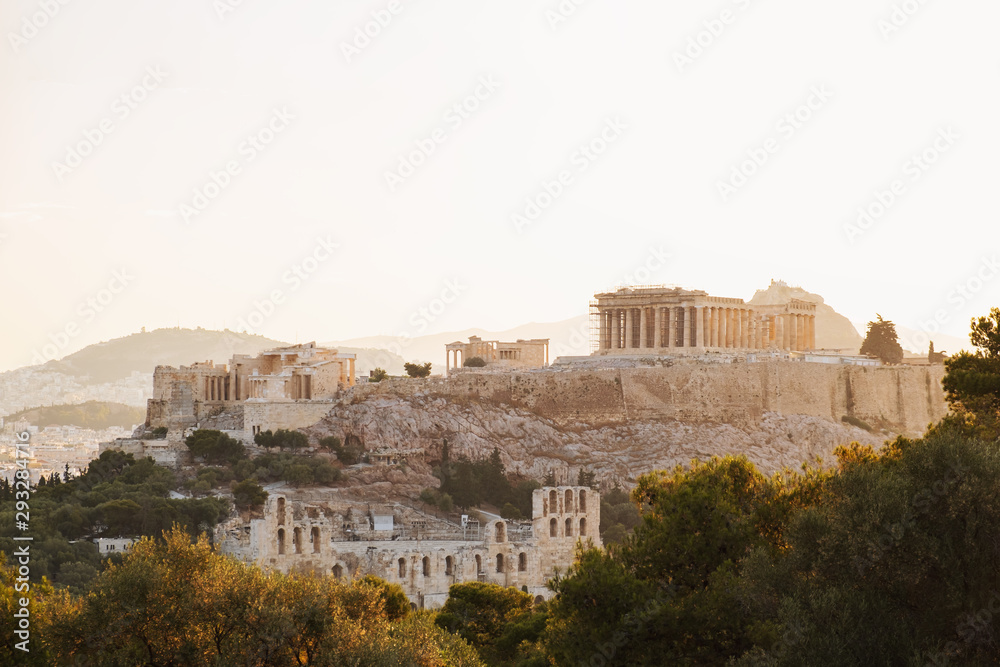 City of Athens, Greece, Parthenon, on main symbol of ancient Greece, Acropolis aerial view drone on panorama of residential buildings sunrise. The lights sun. World Heritage sites. Travel. Tourism