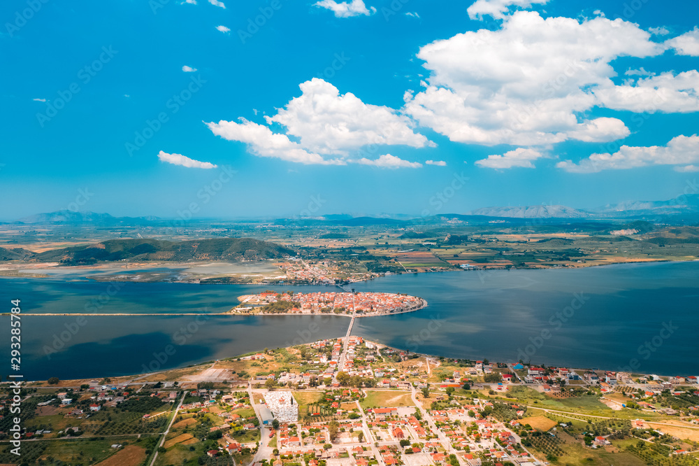 Aerial view from drone panorama of the blue sea and the picturesque islands in Greece, in summer on a sunny day. Beautiful coastline of the resort town. Tourism. Travel
