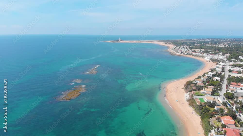 Aerial view of beautiful and desert beach with nobody, pine forest surroundings and clear and cristaline blue waters Aerial view of beautiful and desert beach with nobody, pine forest surroundings and clear and cristaline blue waters