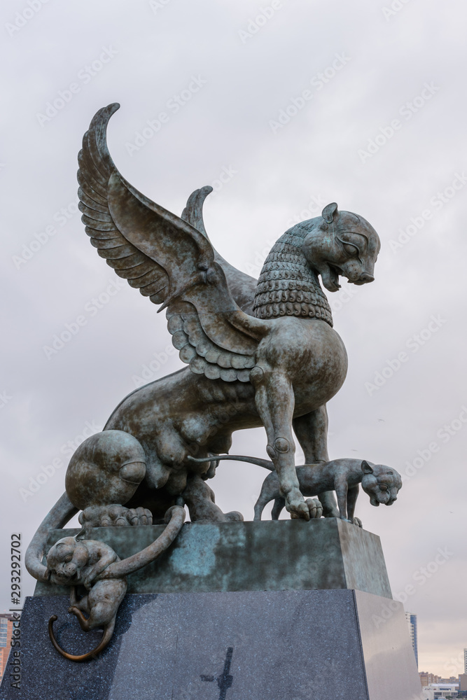 The sculpture female of winged snow leopard (Ak Bars, Aq Bars) with cubs, the symbol of Tatarstan near the Kazan wedding palace in the morning.