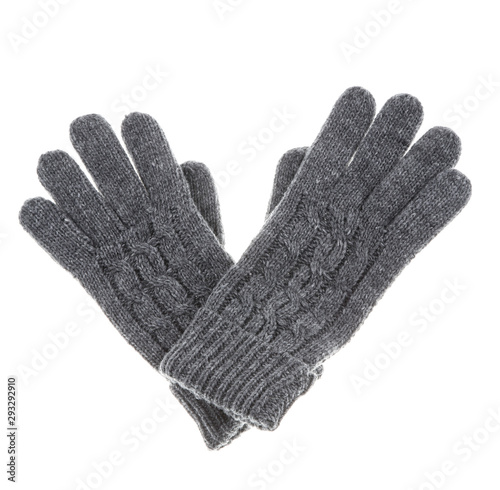 Knitted woollen grey gloves,close up and isolated on white background