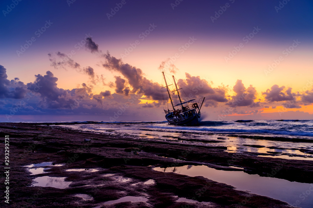 Fishing boat shipwreck or abandoned shipwreck. , Wrecked boat abandoned stand on beach in RHodes