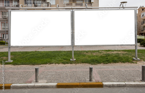 two Bilboards next to each other in the city