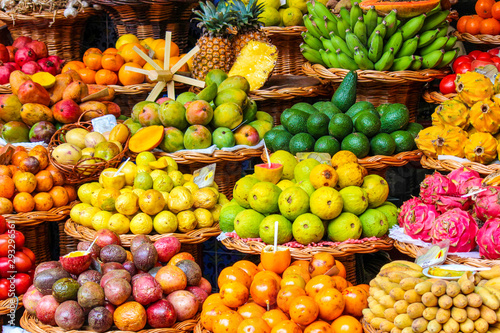 Tropical fruits on the famous market in Funchal  Madeira Island  Portugal. Exotic fruit. Banana  mango  passion fruit or avocado. Colorful food  healthy lifestyle
